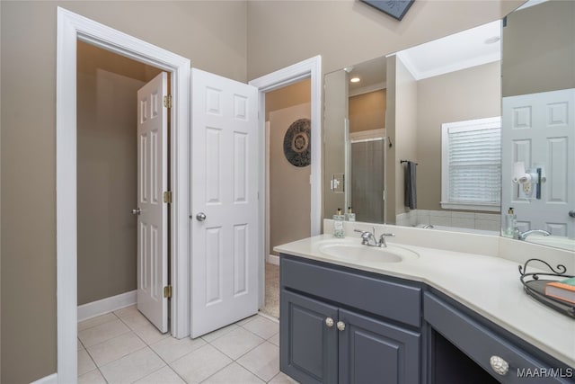 bathroom featuring tile patterned flooring and vanity