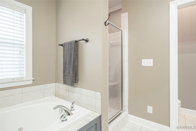 bathroom featuring tile patterned floors, separate shower and tub, and toilet