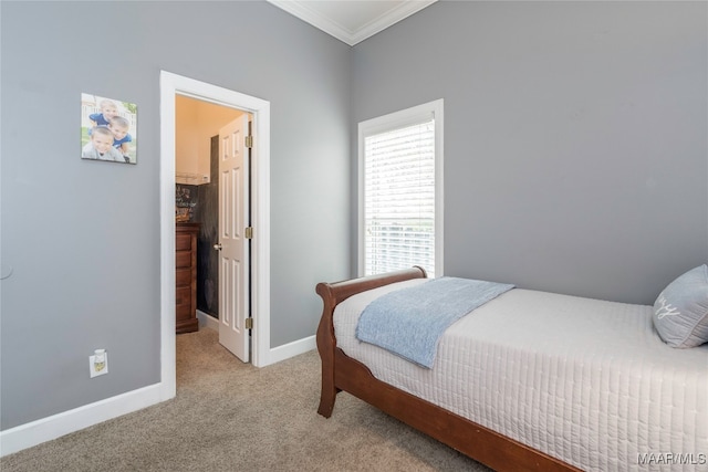 bedroom with ornamental molding and light carpet