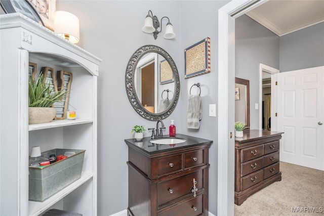 bathroom featuring crown molding and vanity