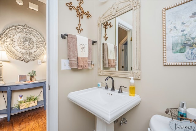 bathroom featuring hardwood / wood-style floors and sink