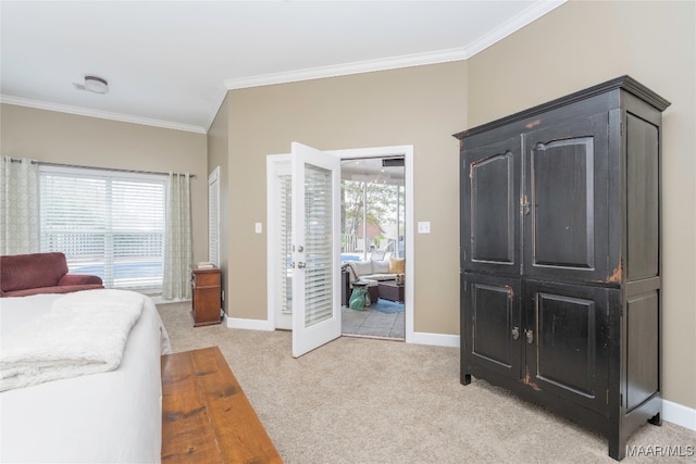 carpeted bedroom with ornamental molding