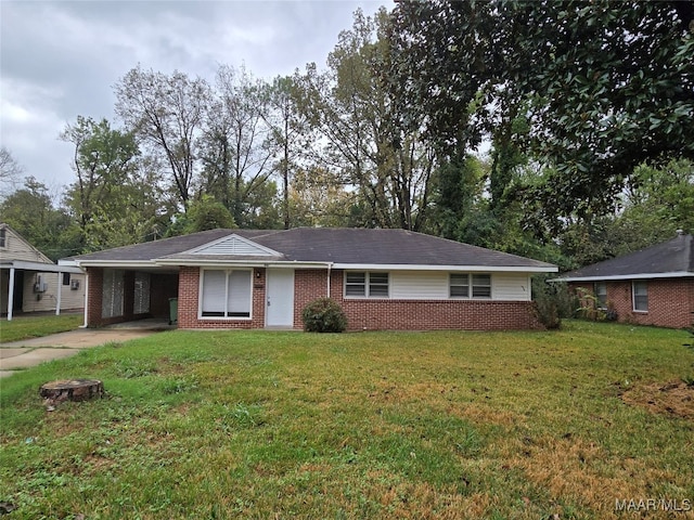 ranch-style house featuring a front yard and a carport