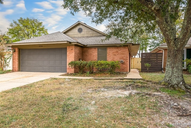 view of front facade with a front lawn and a garage