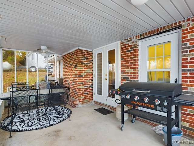 view of patio with french doors, ceiling fan, and a grill