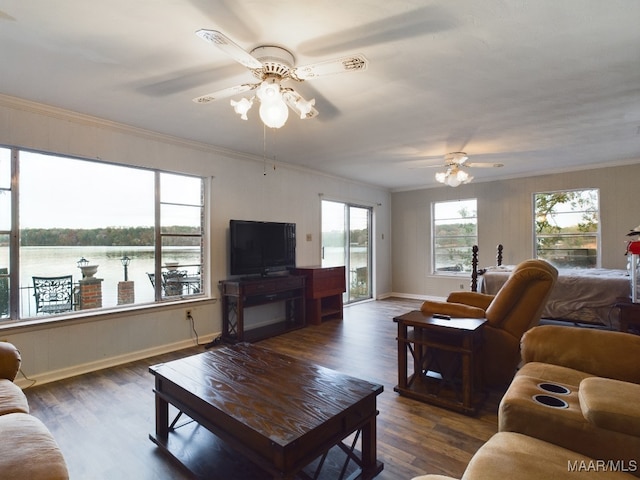 living room featuring ceiling fan, dark hardwood / wood-style flooring, and ornamental molding