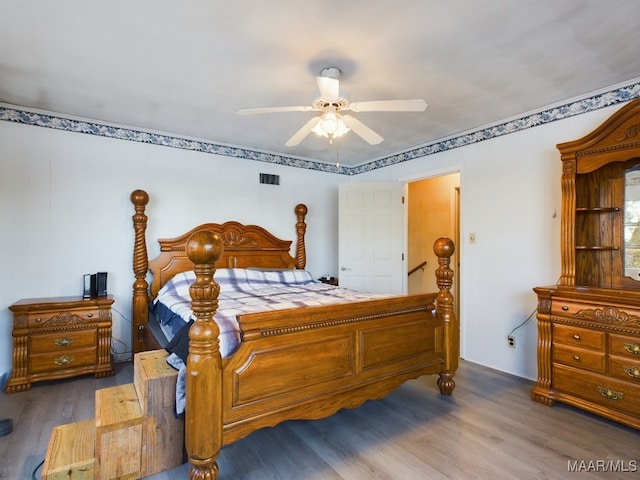 bedroom with hardwood / wood-style flooring and ceiling fan