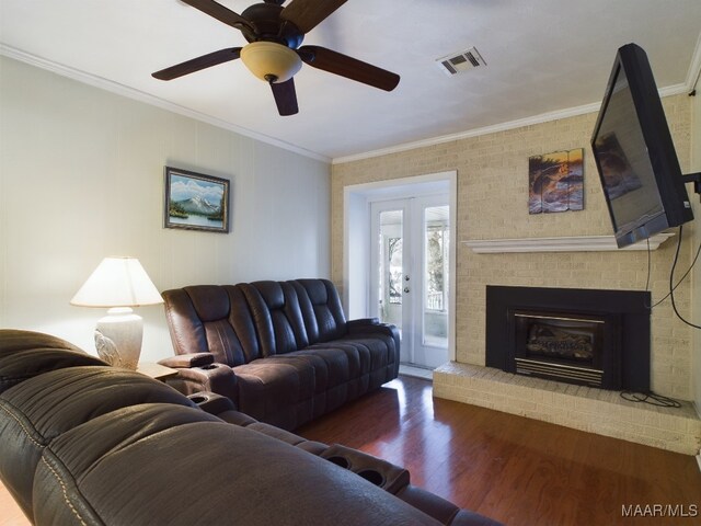 983 Lake Haven Dr, Deatsville, AL 36022 - living area featuring wood finished floors, ceiling fan, crown molding, a fireplace, and french doors