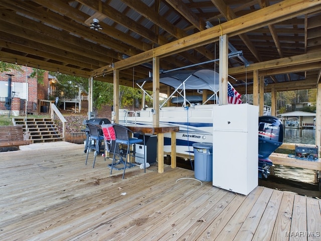 983 Lake Haven Dr, Deatsville, AL 36022 - deck featuring boat lift, a dock, and a grill