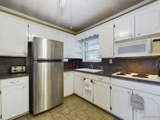 983 Lake Haven Dr, Deatsville, AL 36022 - kitchen featuring white appliances, backsplash, dark countertops, white cabinetry, and ornamental molding