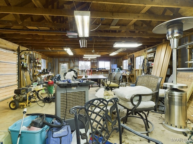 misc room featuring a workshop area and concrete flooring