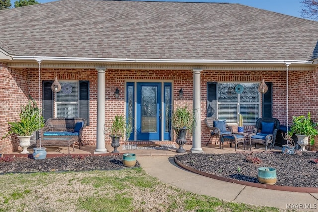 entrance to property featuring covered porch