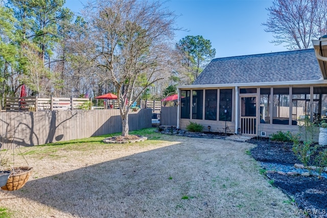 view of yard with a sunroom