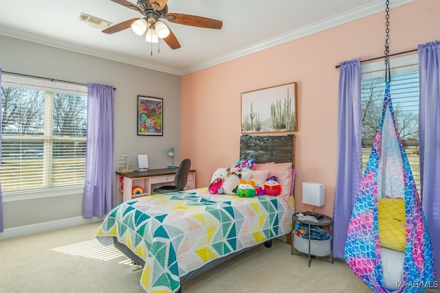 bedroom featuring light carpet, ceiling fan, and crown molding