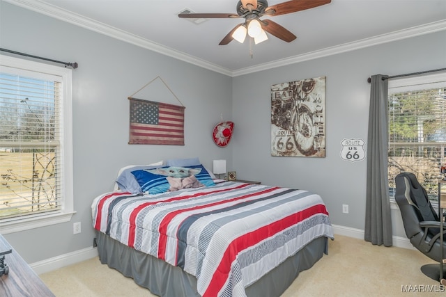 carpeted bedroom with ceiling fan and crown molding