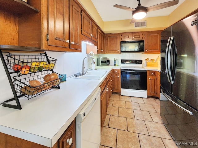 kitchen with ceiling fan, light tile patterned flooring, white appliances, and sink