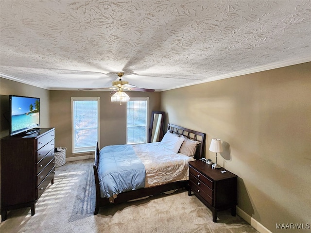 carpeted bedroom with ceiling fan, ornamental molding, and a textured ceiling