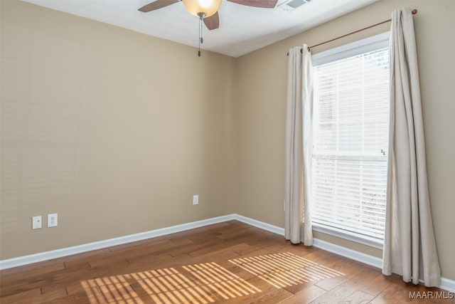 unfurnished room with wood-type flooring and ceiling fan