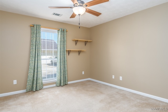 carpeted empty room with ceiling fan