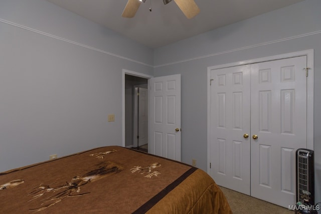 unfurnished bedroom featuring ceiling fan, a closet, and carpet floors