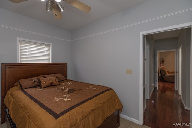 bedroom with hardwood / wood-style floors and ceiling fan