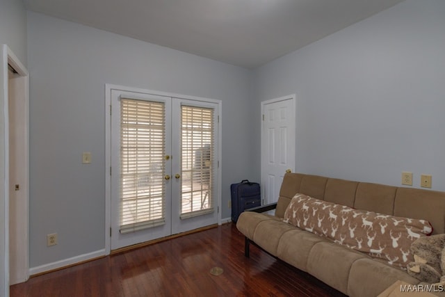 living room featuring french doors and dark hardwood / wood-style flooring