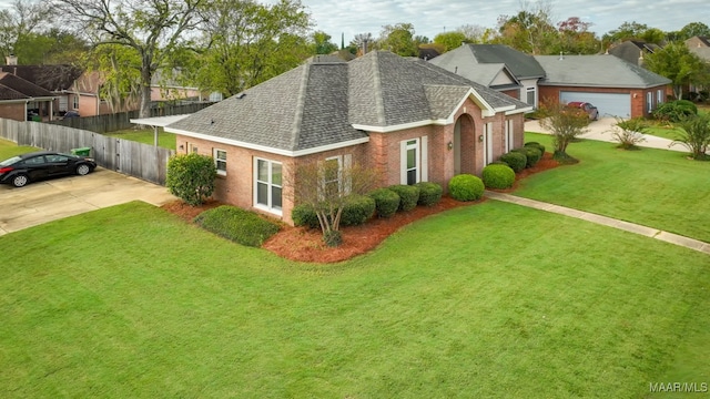 view of front of house featuring a front yard and a garage