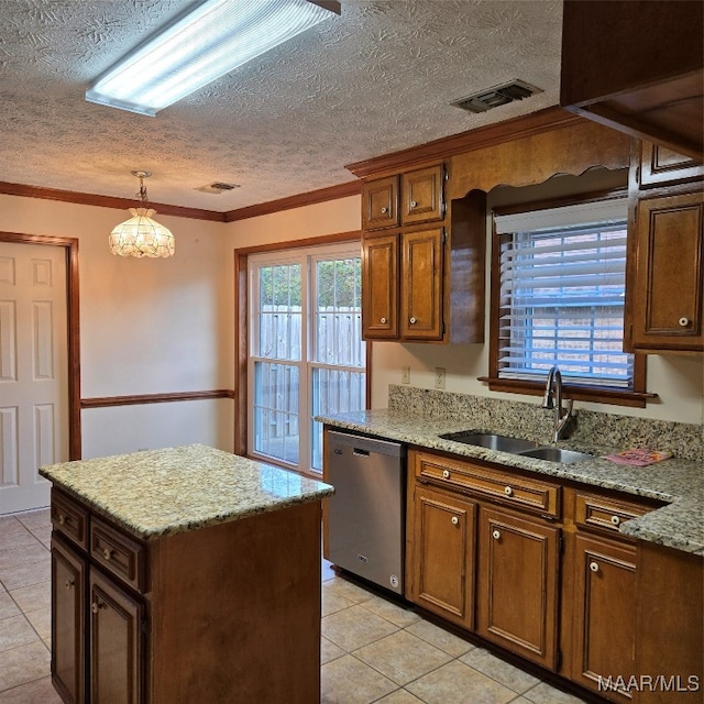 kitchen with sink, hanging light fixtures, stainless steel dishwasher, a textured ceiling, and ornamental molding