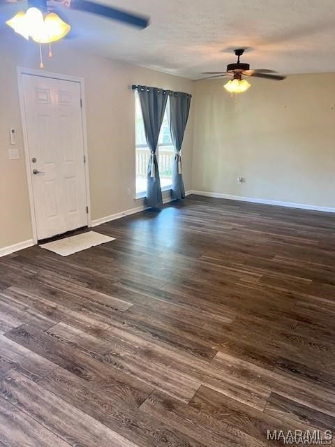 foyer featuring ceiling fan and dark hardwood / wood-style flooring