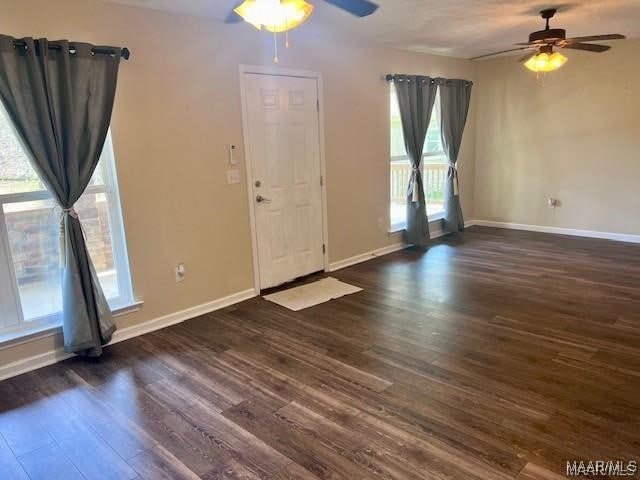 foyer featuring ceiling fan and dark hardwood / wood-style flooring