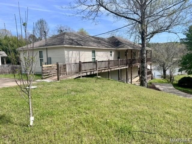 exterior space featuring a yard and a deck