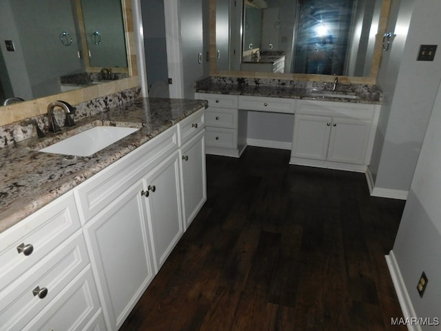 bathroom with hardwood / wood-style floors and vanity