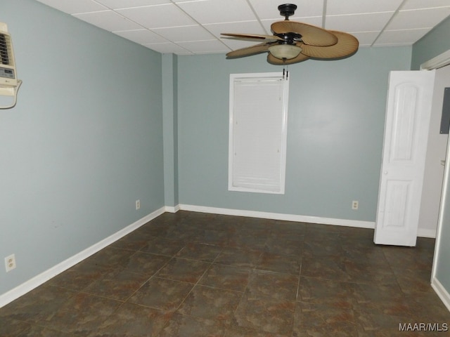 unfurnished room featuring a paneled ceiling and ceiling fan