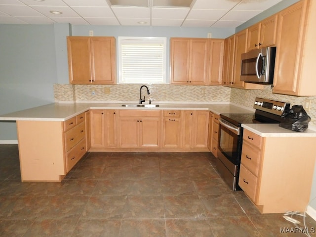 kitchen featuring light brown cabinets, stainless steel appliances, a drop ceiling, and sink