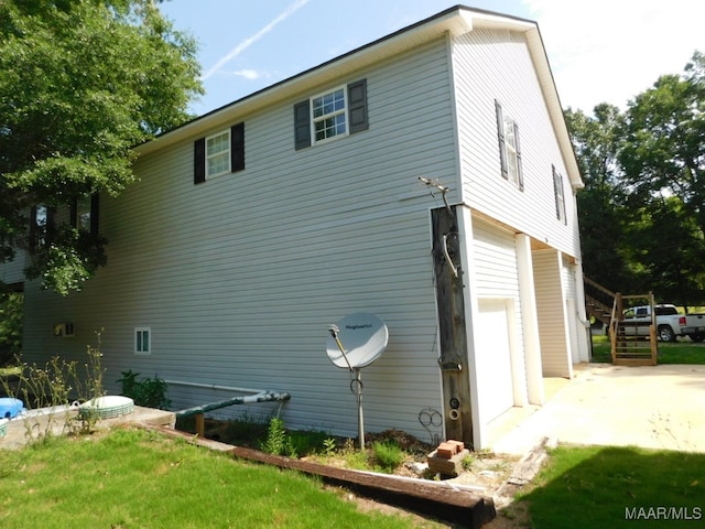 view of side of property featuring a garage