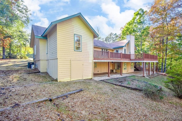 171 Griffith Ln, Tallassee, AL 36078 - rear view of property with a wooden deck, a patio area, and central AC