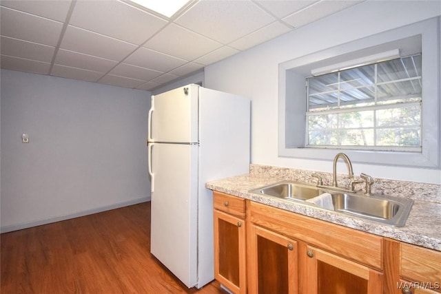 171 Griffith Ln, Tallassee, AL 36078 - kitchen with a sink, freestanding refrigerator, light countertops, wood finished floors, and a drop ceiling