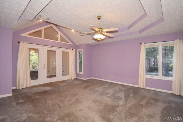 171 Griffith Ln, Tallassee, AL 36078 - carpeted spare room with a textured ceiling, french doors, plenty of natural light, baseboards, and lofted ceiling