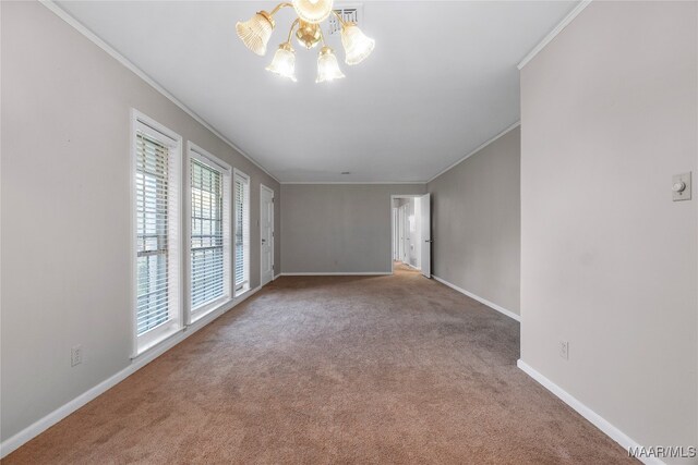 carpeted spare room with a chandelier, crown molding, and a healthy amount of sunlight