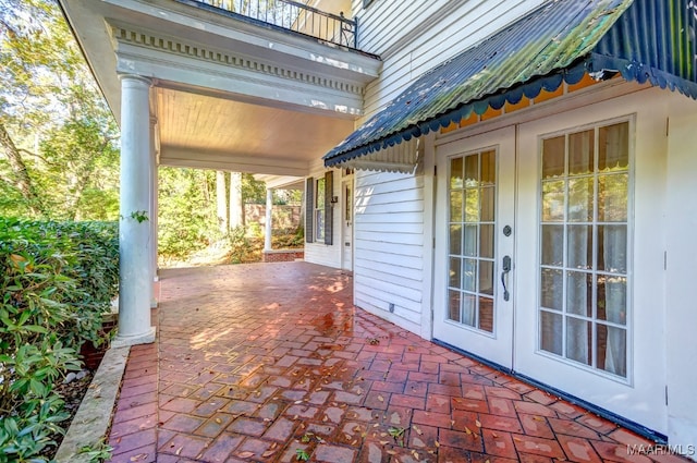 view of patio / terrace with french doors and a balcony