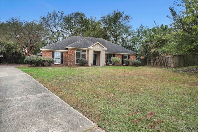 single story home with a front lawn