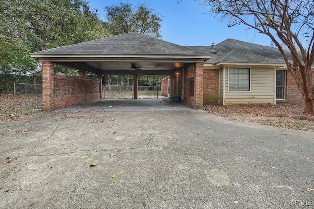 view of front of house with a carport and ceiling fan