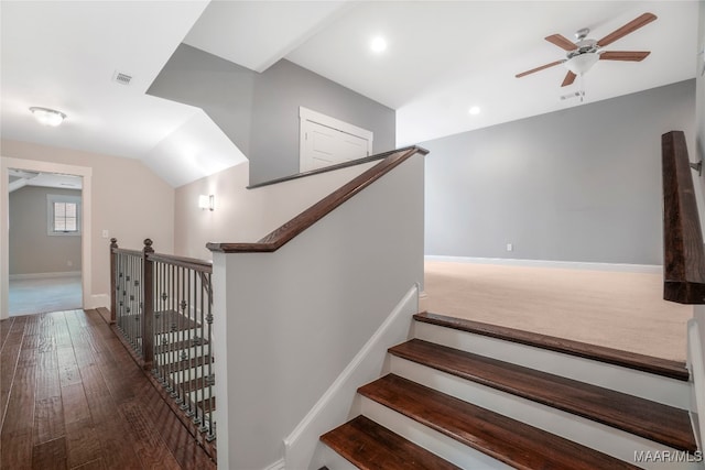 stairway featuring hardwood / wood-style flooring and ceiling fan