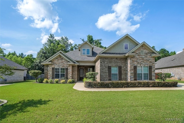 craftsman-style house featuring a front lawn