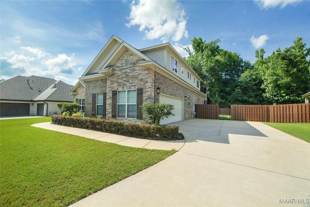 view of front of property featuring a front yard and a garage