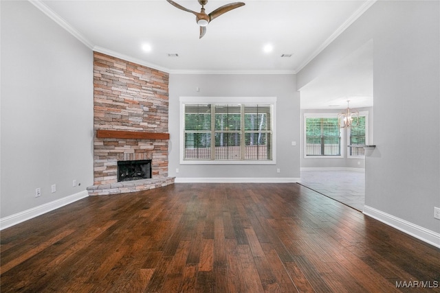 unfurnished living room featuring ceiling fan, a fireplace, dark hardwood / wood-style floors, and ornamental molding