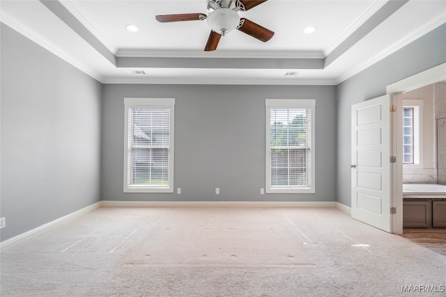 unfurnished bedroom featuring ceiling fan, light colored carpet, and ornamental molding