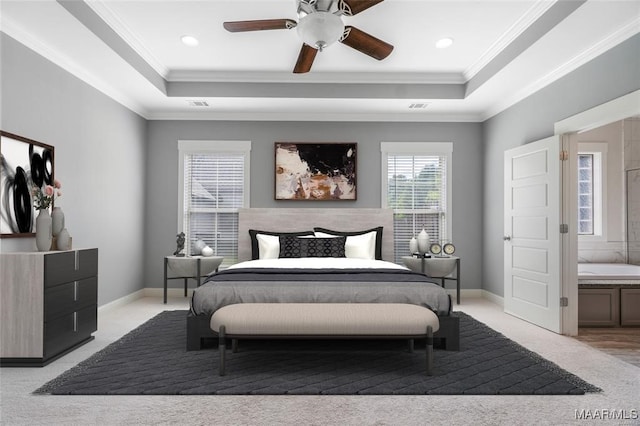 carpeted bedroom featuring a raised ceiling, ceiling fan, and crown molding