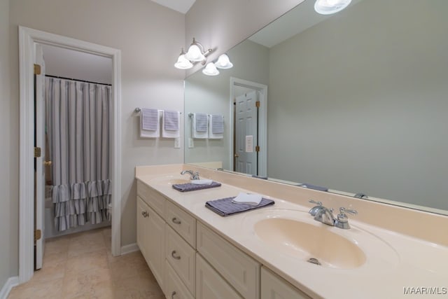 bathroom with tile patterned floors and vanity