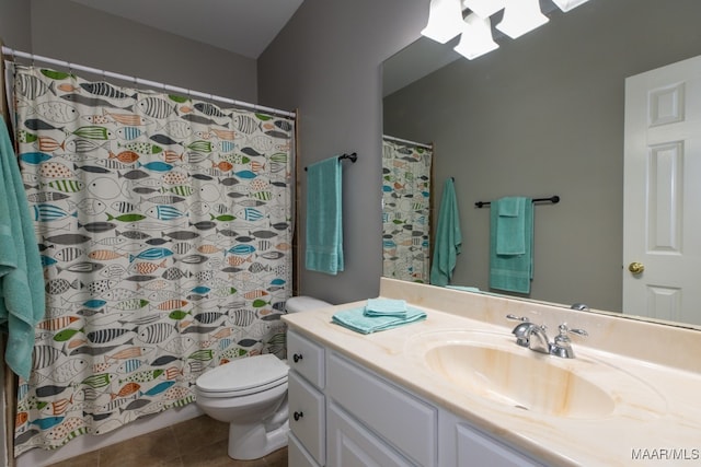 bathroom featuring tile patterned floors, vanity, and toilet